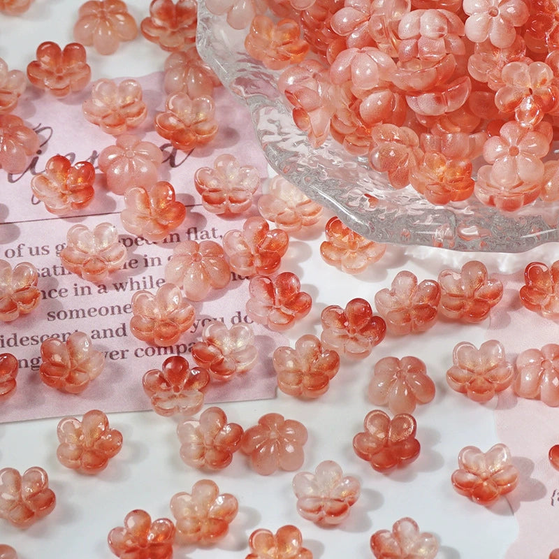 10mm glass plum blossom beads in Cherry Red Gold, 50 pieces per pack