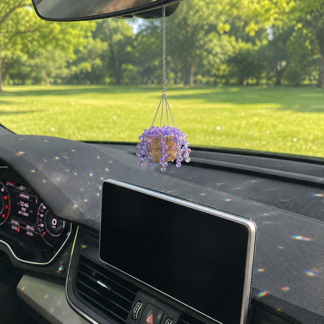 Purple crystal beaded plant car charm sparkling in natural sunlight