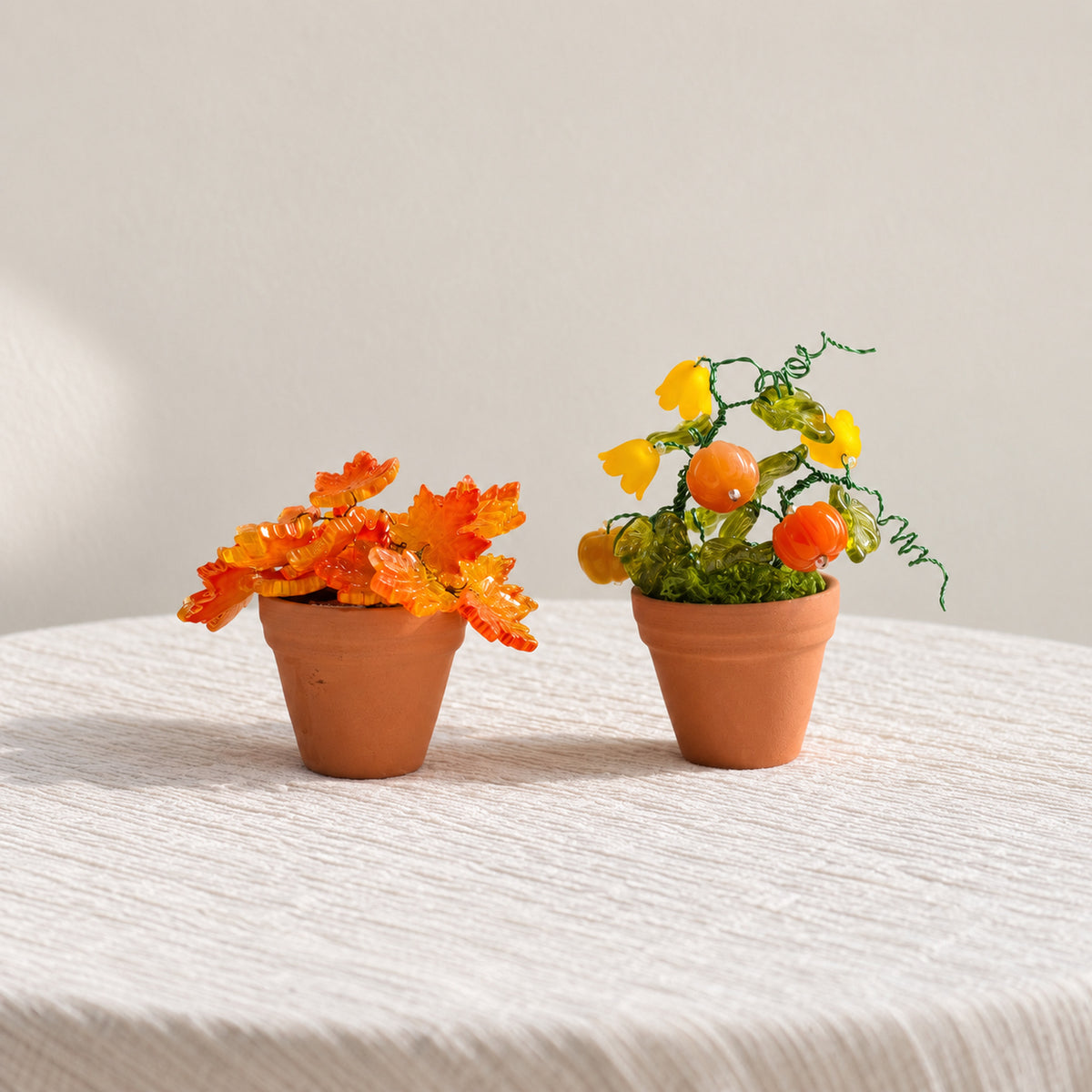 Pumpkin and maple leaf mini beaded plants shown together