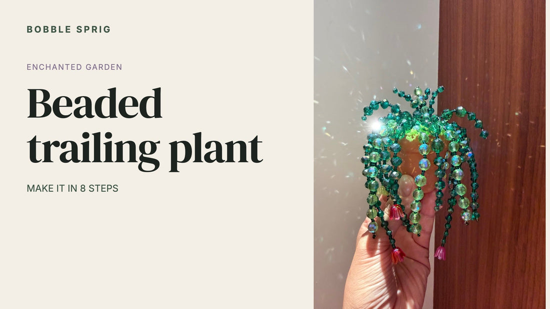 Beaded trailing plant cover: green glass bead strands with pink glass flowers held in a hand