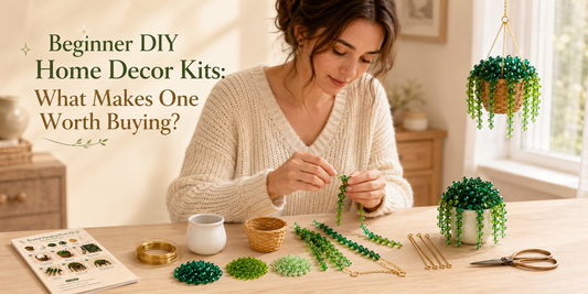 Young woman making a Bobble Sprig beaded plant DIY home decor kit with a finished hanging plant and white mini pot beaded plant nearby.