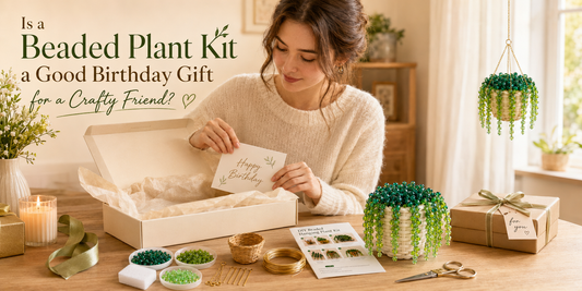 Birthday gift box with a Bobble Sprig beaded plant DIY kit, green beads, gold wire, and a finished white mini pot beaded plant for a crafty friend.