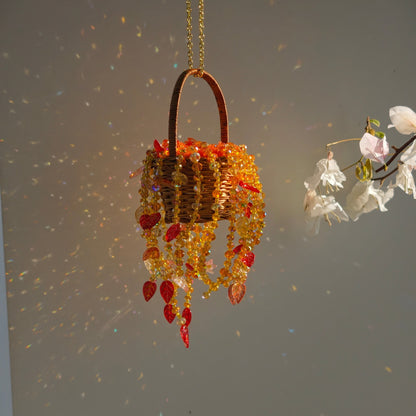Autumn Dusk hanging basket with glass bead strands reflecting colorful sunlight