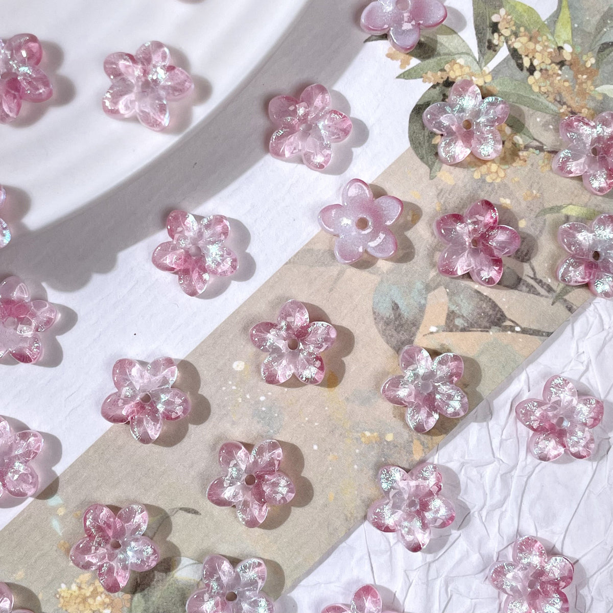 10mm five-petal glass flower beads in Iridescent Blush Pink, 50 pieces per pack