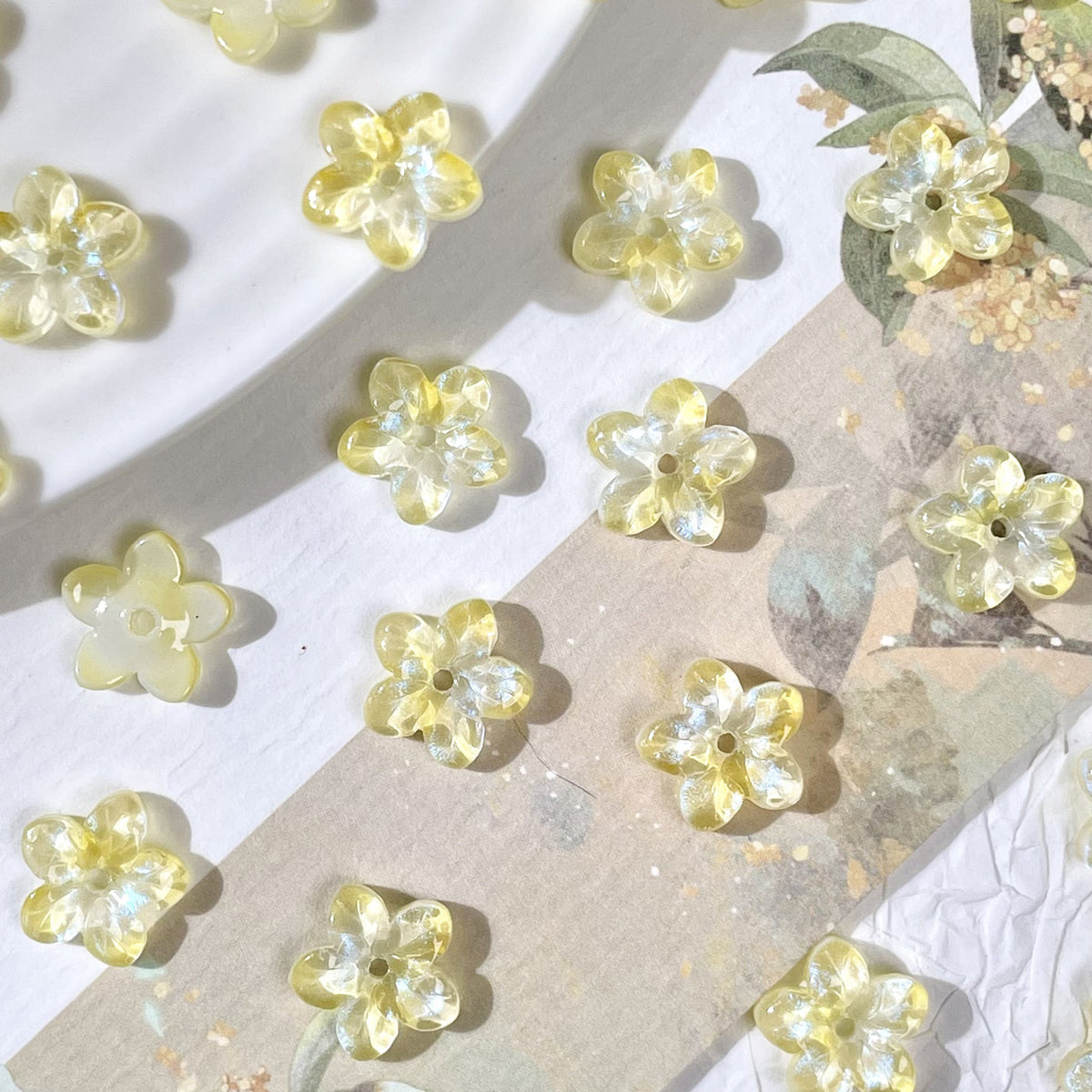 10mm five-petal glass flower beads in Iridescent Yellow, 50 pieces per pack