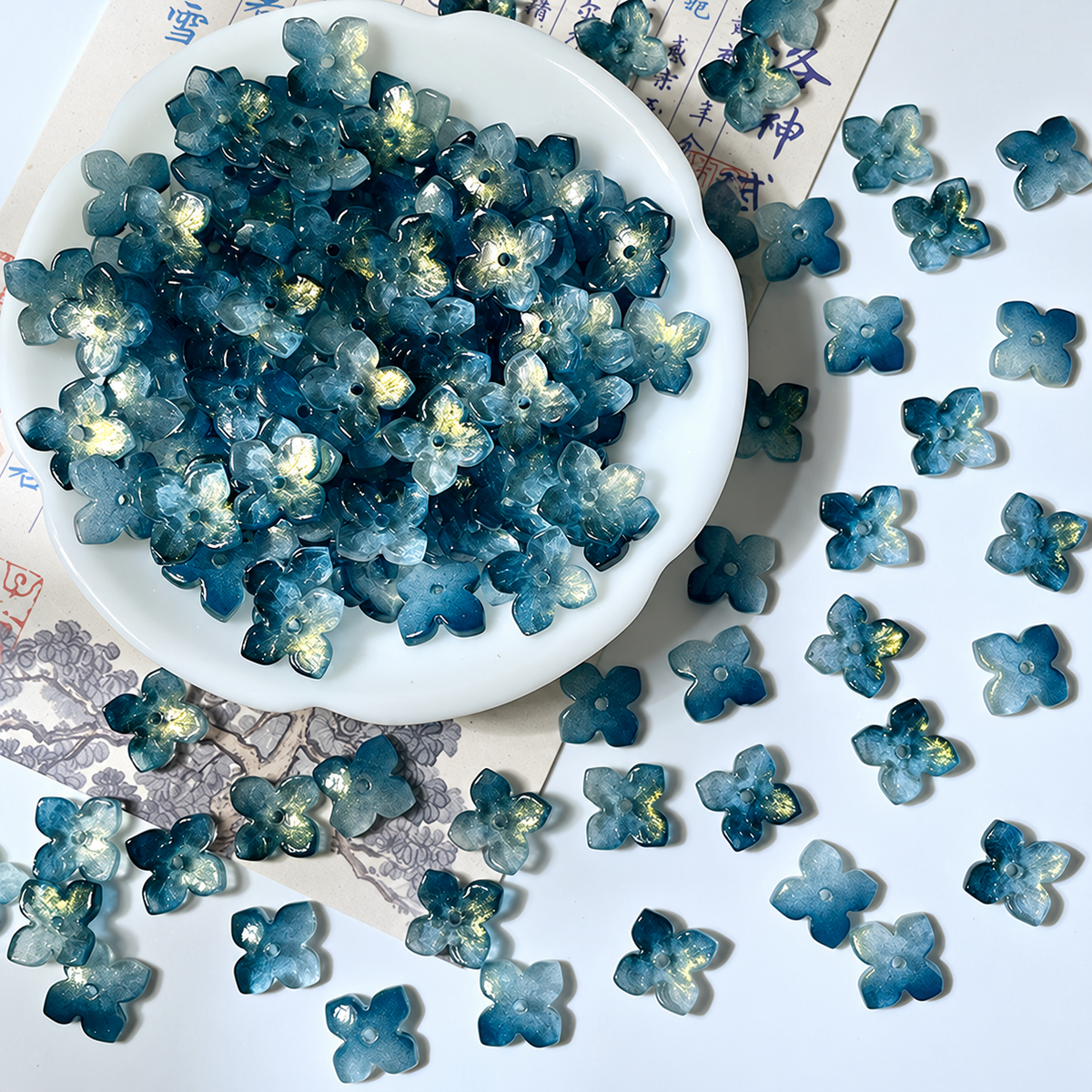 10mm four-petal glass hydrangea beads in Deep Teal Gold, 50 pieces per pack