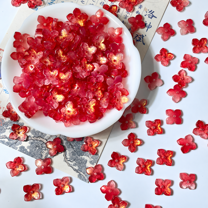 10mm four-petal glass hydrangea beads in Ruby Red Gold, 50 pieces per pack
