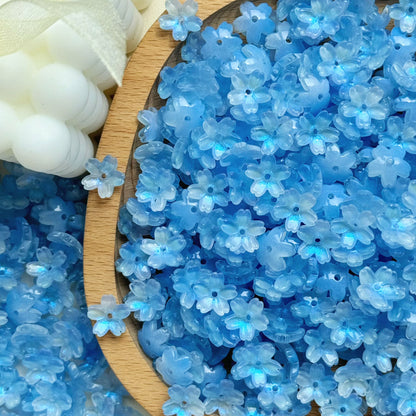 Glass cherry blossom beads in blue - 50 beads per pack
