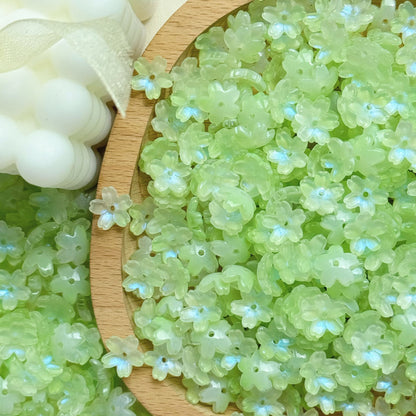 Glass cherry blossom beads in green - 50 beads per pack
