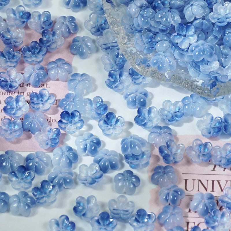 10mm glass plum blossom beads in Ice Blue Gold, 50 pieces per pack