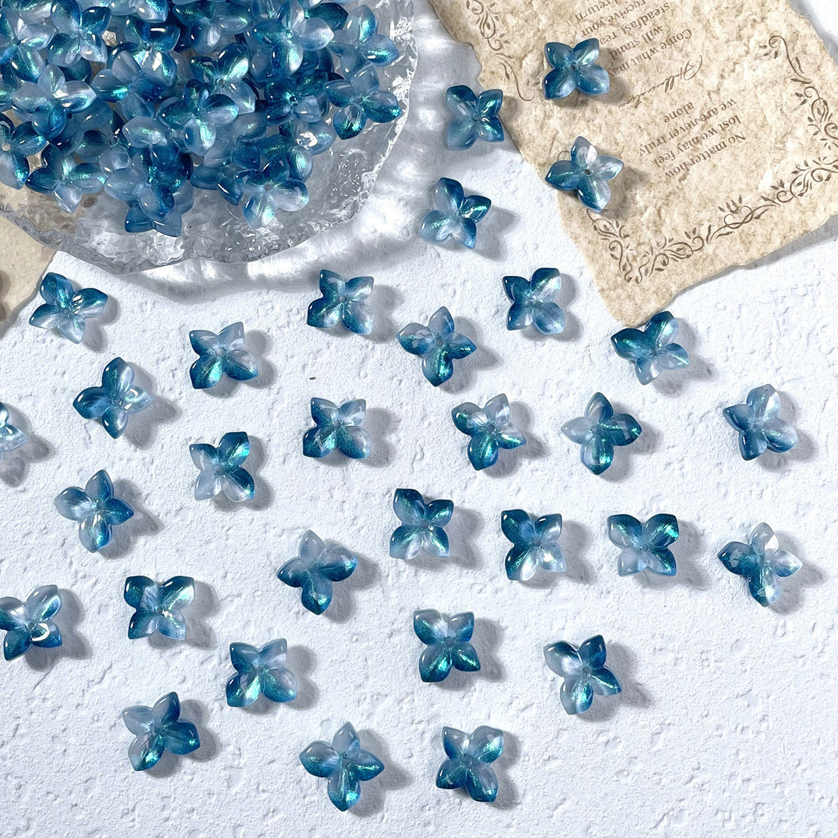 11x12mm glass hydrangea flower beads in Iridescent Deep Teal, 50 pieces per pack
