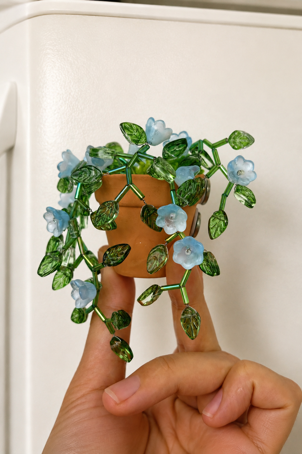 Finished teal beaded plant fridge magnet with crystal bead vines