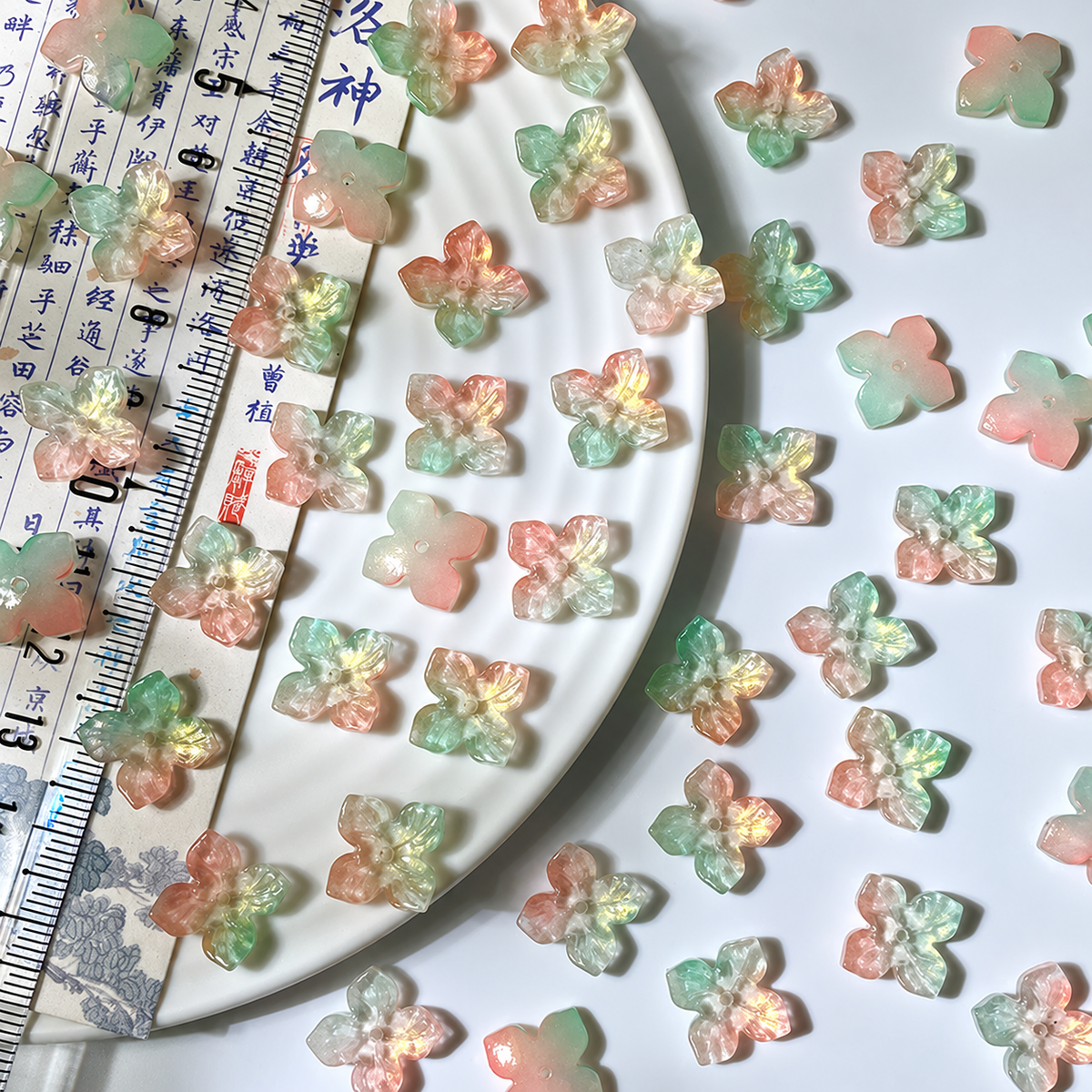 12mm four-petal glass hydrangea beads in Peach and Mint Gold, 50 pieces per pack