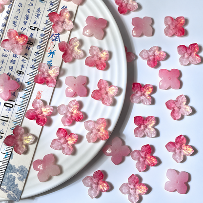 14mm four-petal glass hydrangea beads in Peach Blossom Gold, 50 pieces per pack