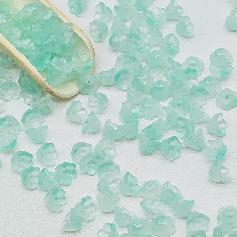 7 x 12 mm glass lily of the valley flower beads in aqua green - 50 beads per pack