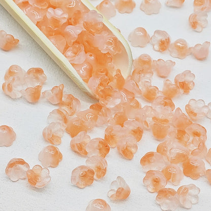 7 x 12 mm glass lily of the valley flower beads in orange - 50 beads per pack