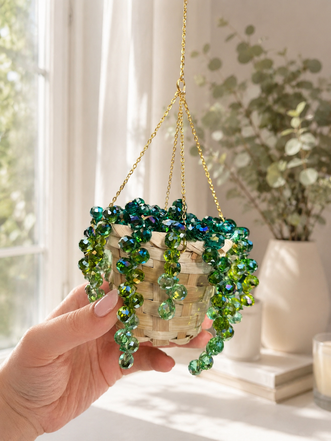 Finished beaded hanging plant suncatcher displayed by a sunny window