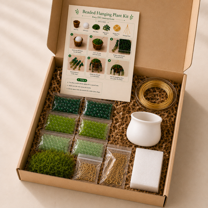 White mini pot beaded plant DIY kit materials with three shades of green beads, 180 pieces per color, gold beading wire, faux moss, hook pins, and foam block
