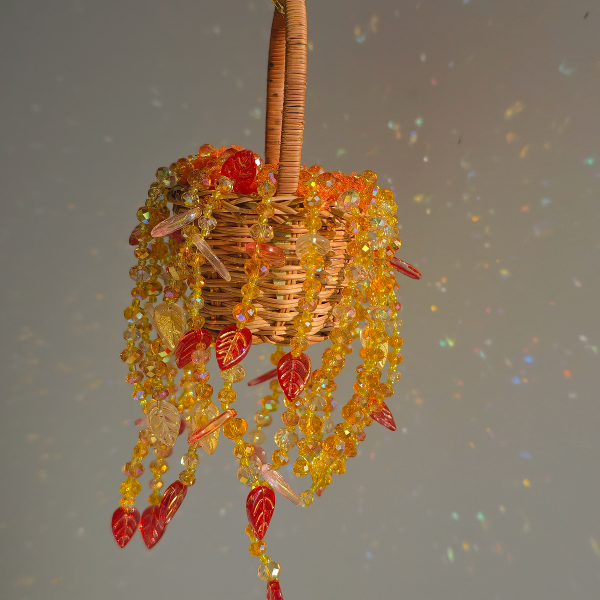 Small autumn-colored beaded hanging basket for windows and shelves