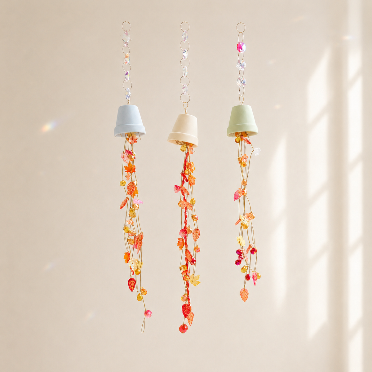 Set of three autumn beaded flower bells with pastel mini pots