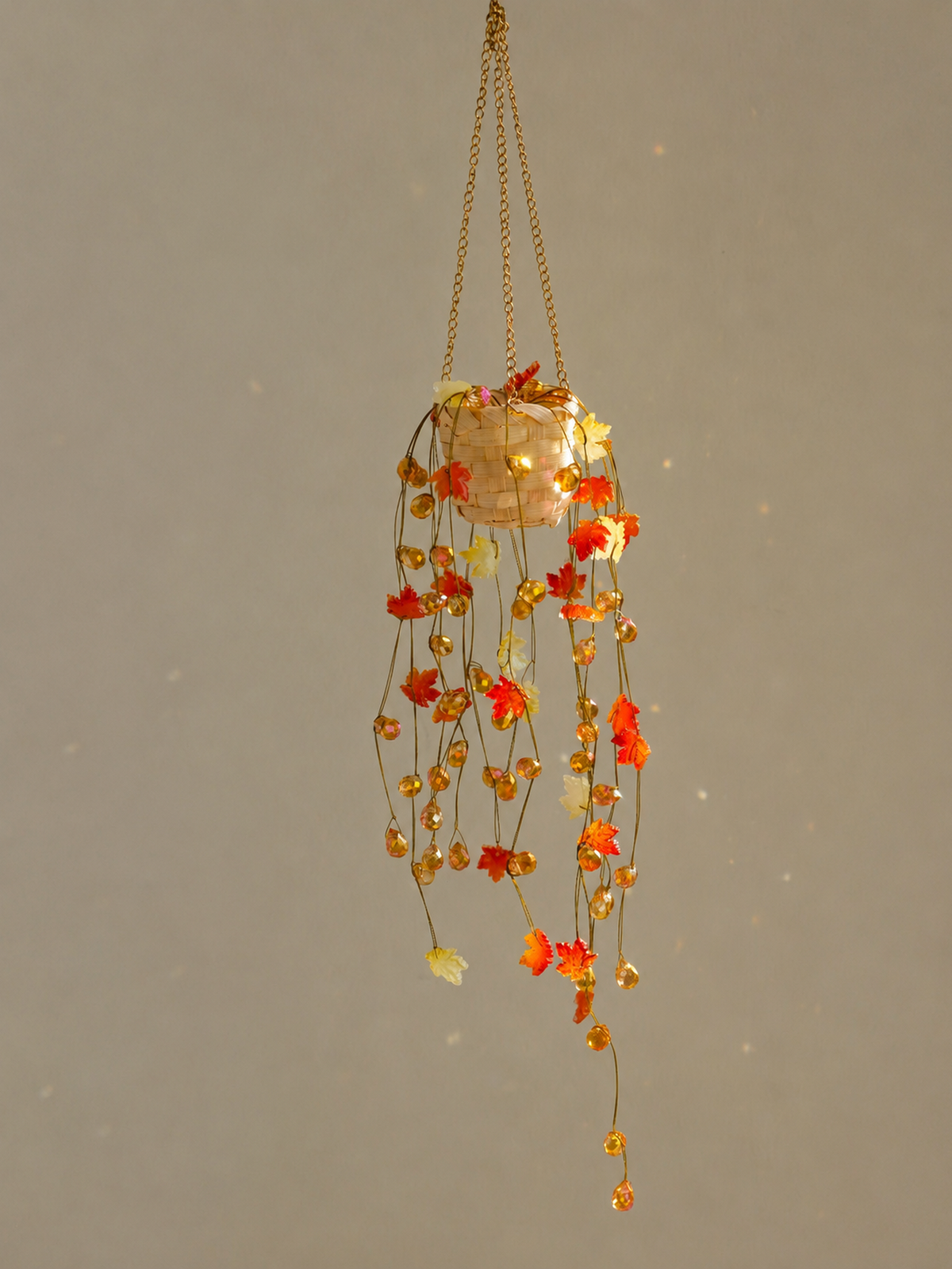 Autumn maple beaded plant with amber and burnt-orange faceted glass beads cascading from a gold chain
