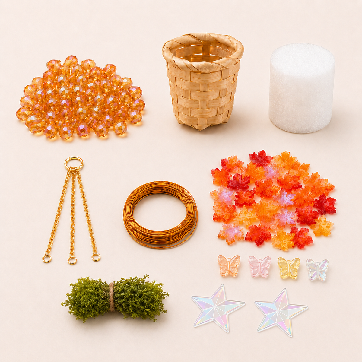 Maple Leaves DIY kit contents with autumn beads, woven basket, faux grass, gold chain, wire, foam and two star stickers
