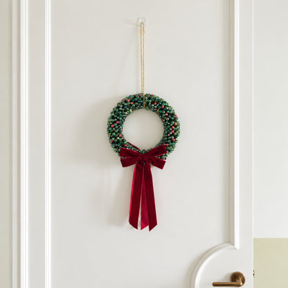 Large Full 20 cm beaded Christmas wreath displayed on an interior door