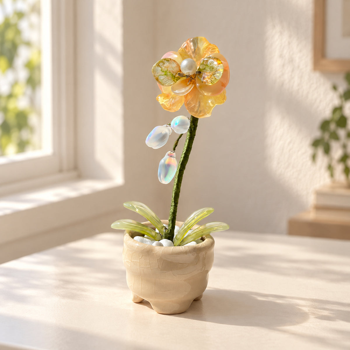 Yellow beaded moth orchid in a cream footed pot on a sunlit desk — finished example