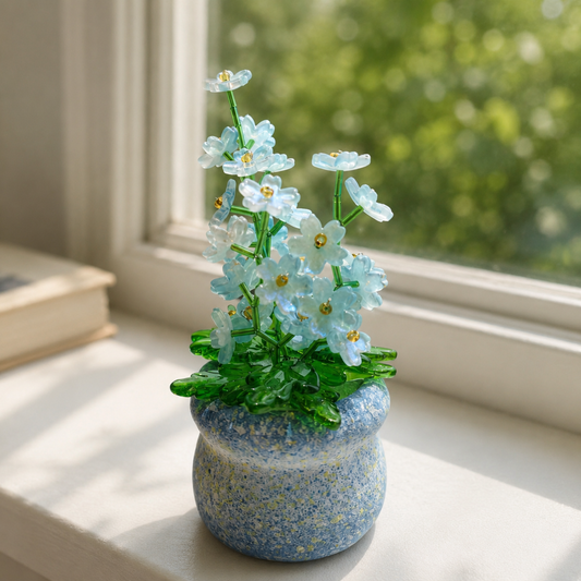 Blue forget-me-not beaded plant beside a sunny reading nook window