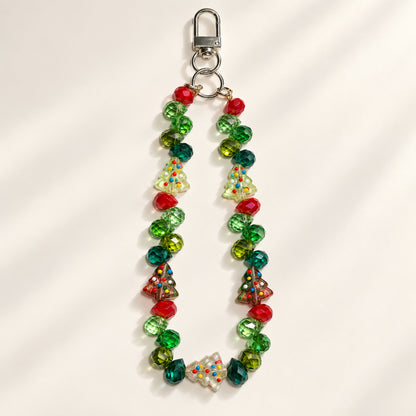 Christmas Tree design beaded phone and bag charm with green and red faceted beads, five tree-shaped beads and a silver-tone clasp
