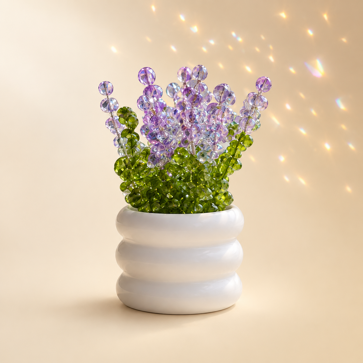 Crystal lavender beaded plant with lilac blooms in a ribbed white ceramic pot, catching warm light