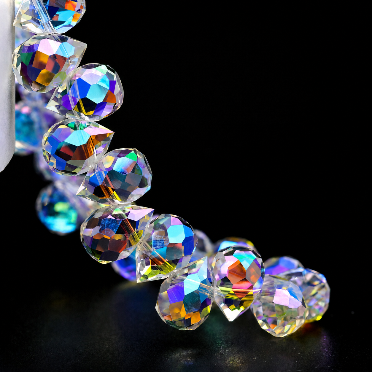 Heavenly Light faceted teardrop K9 glass bead strand