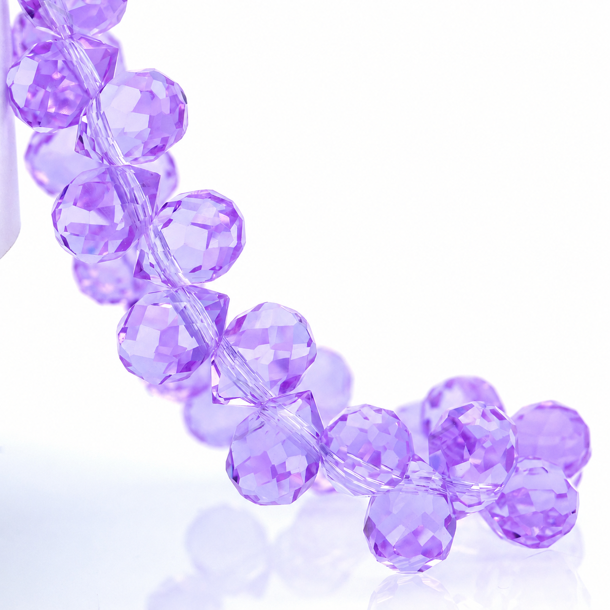 Natural Crystal Purple faceted teardrop K9 glass bead strand