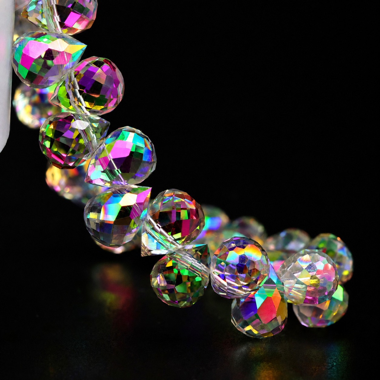 Sunlit Pink faceted teardrop K9 glass bead strand