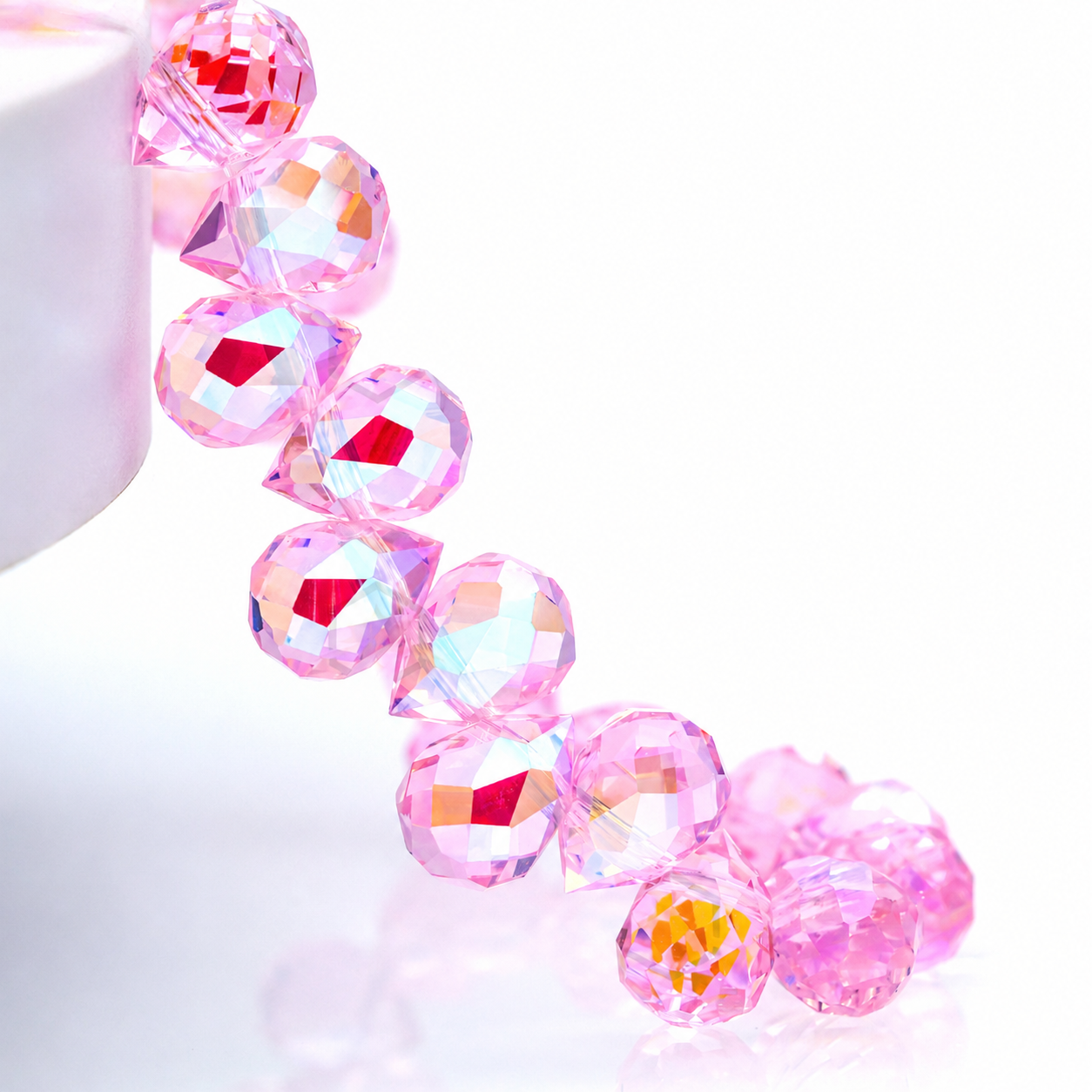Pink Heavenly Light faceted teardrop K9 glass bead strand