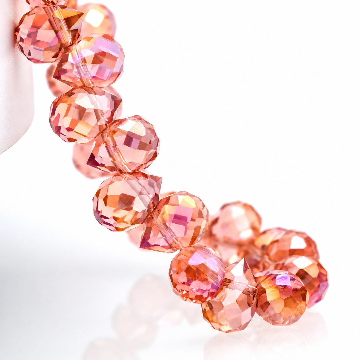 Grapefruit Red AB faceted teardrop K9 glass bead strand