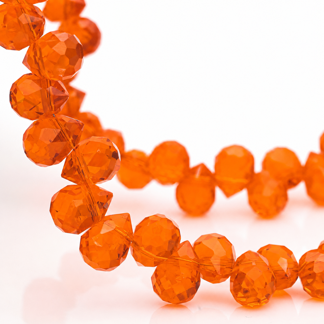 Orange Red faceted teardrop K9 glass bead strand