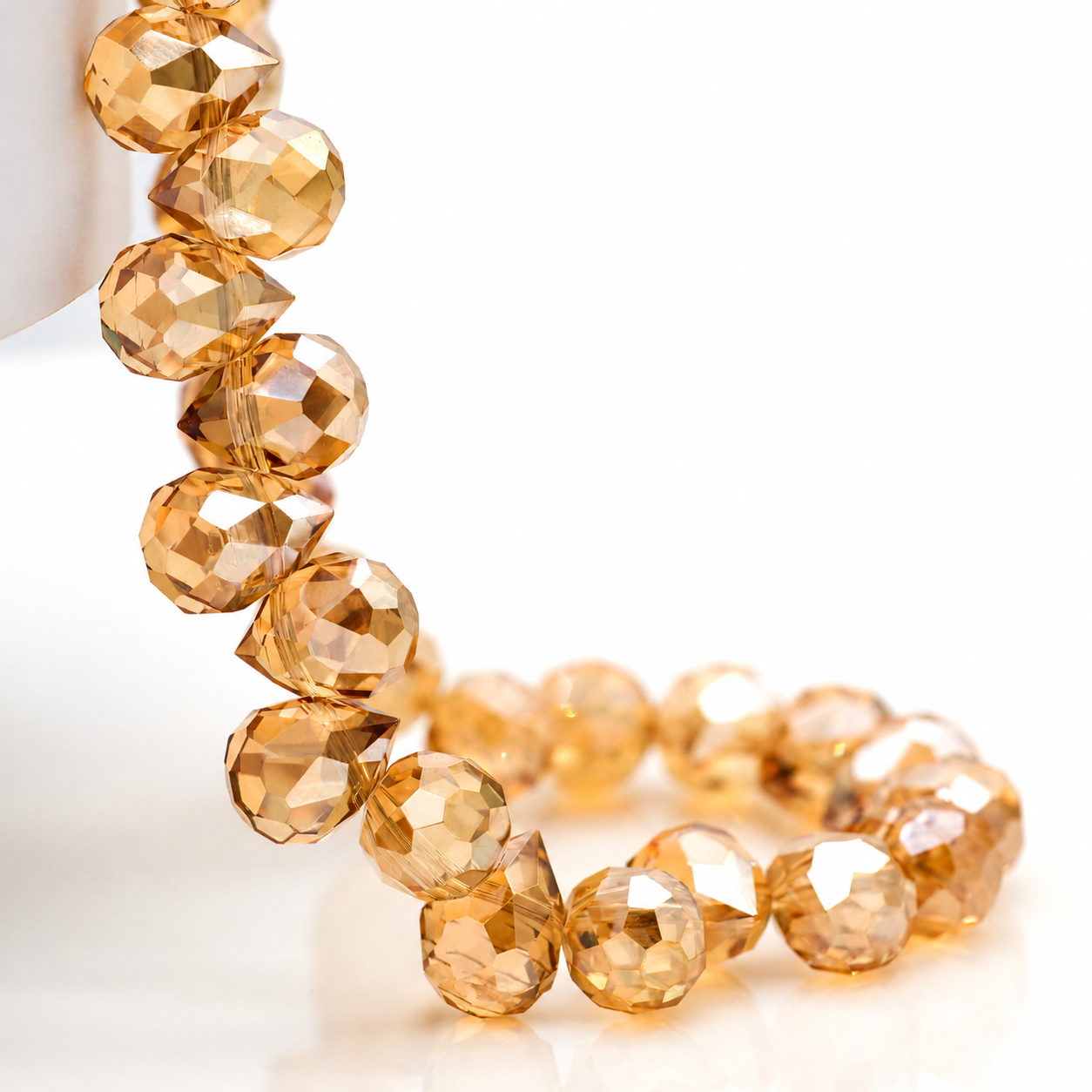 Amber Gold faceted teardrop K9 glass bead strand
