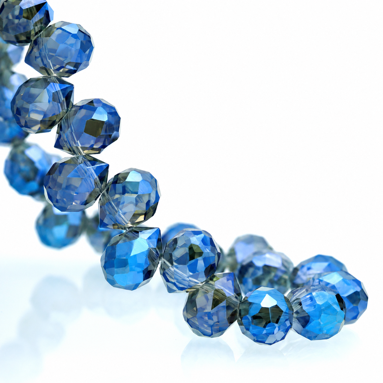 Metallic Ink Blue faceted teardrop K9 glass bead strand