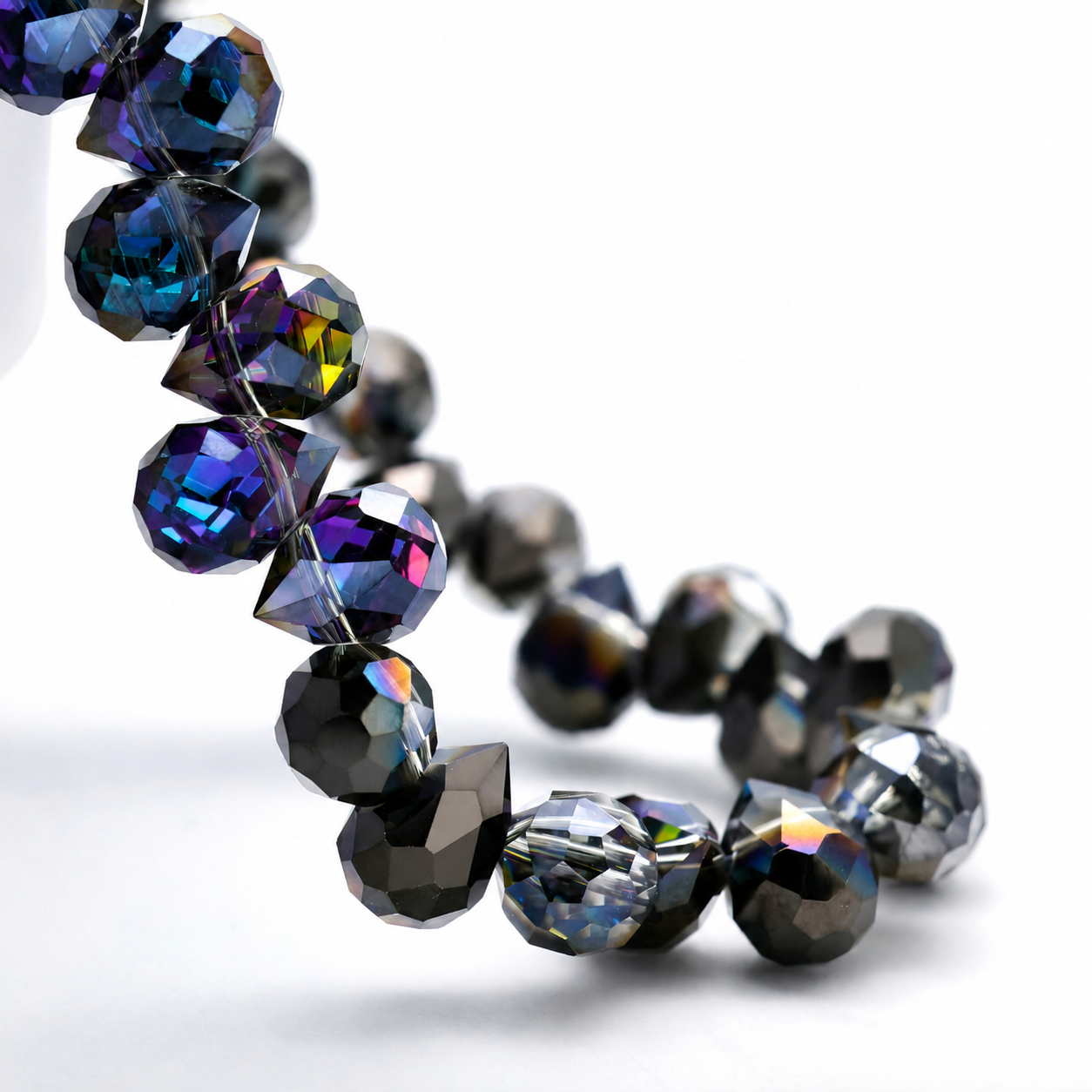 Fuchsia Gunmetal faceted teardrop K9 glass bead strand