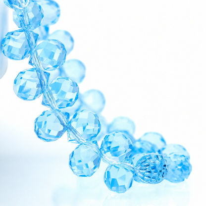 Ice Blue faceted teardrop K9 glass bead strand