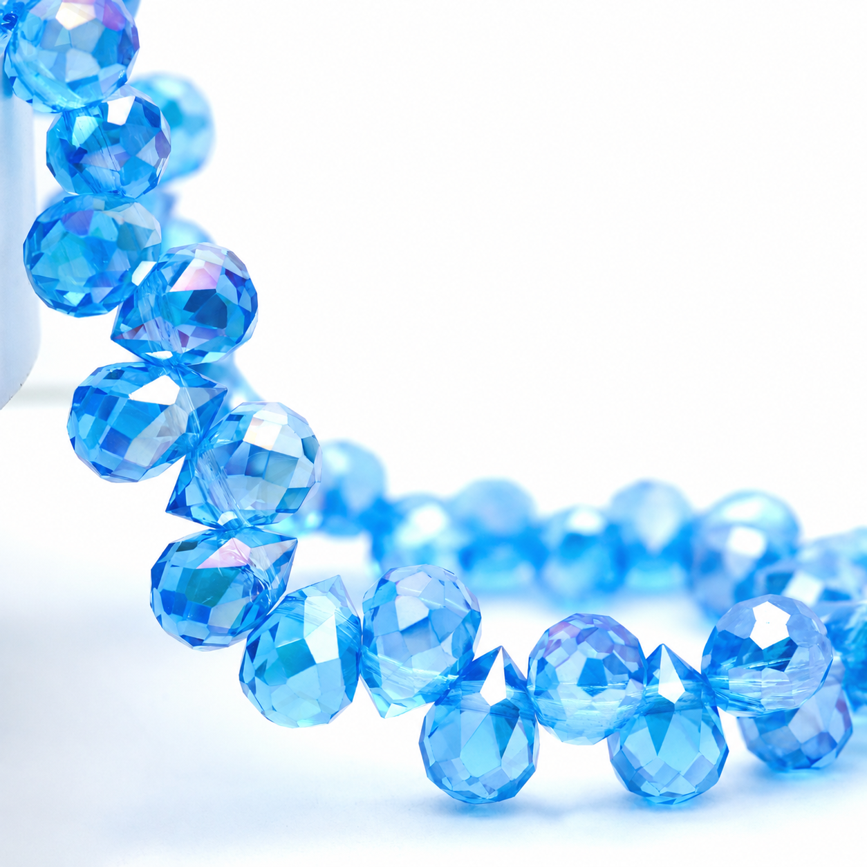 Lake Blue AB faceted teardrop K9 glass bead strand