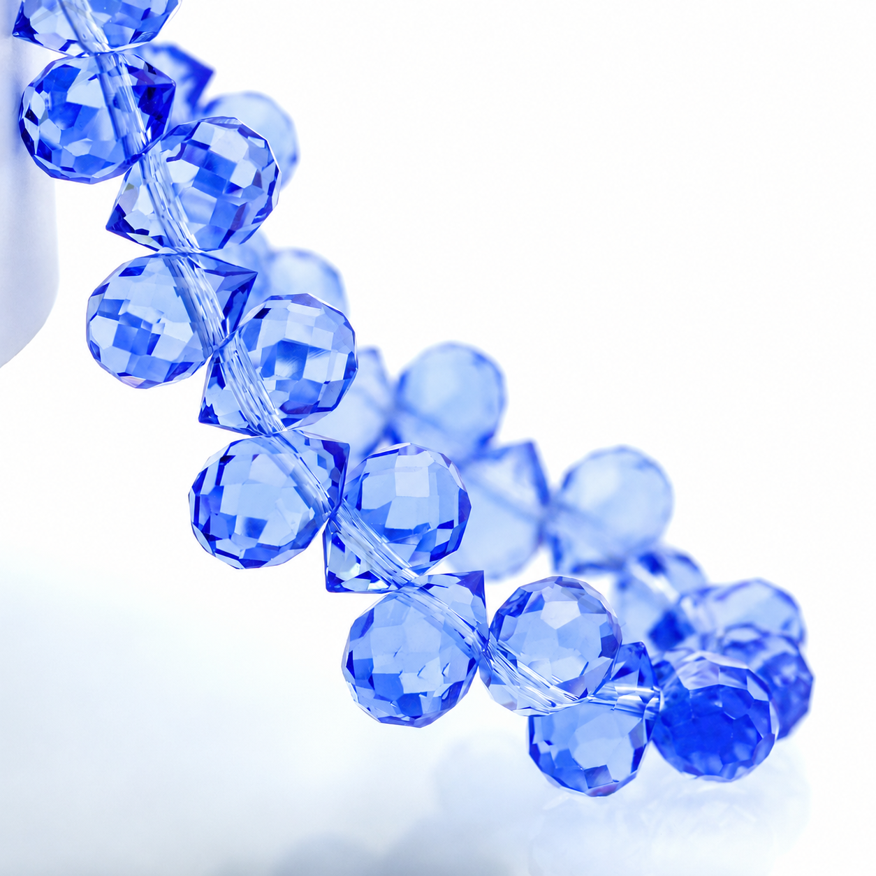 Light Blue faceted teardrop K9 glass bead strand