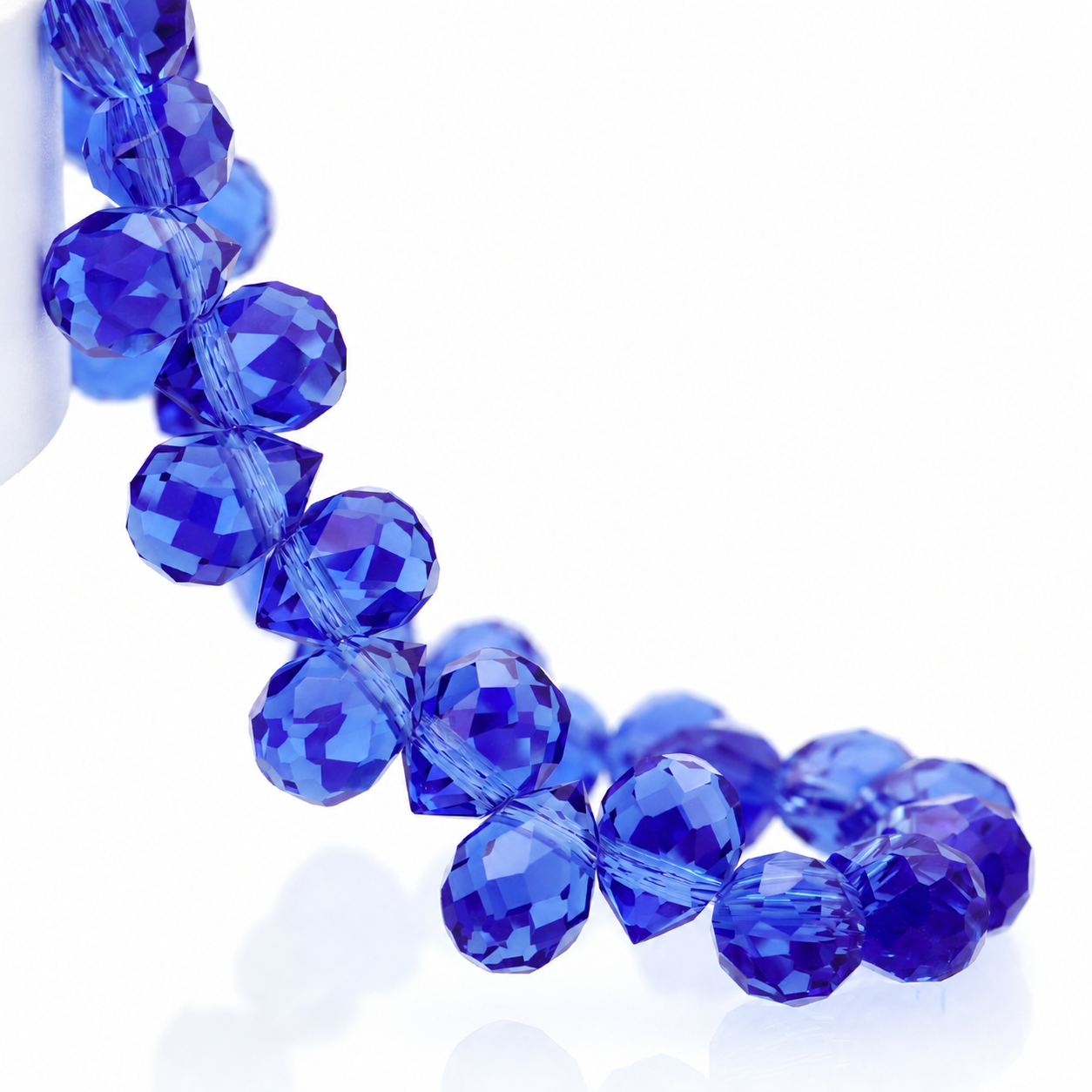 Medium Blue faceted teardrop K9 glass bead strand