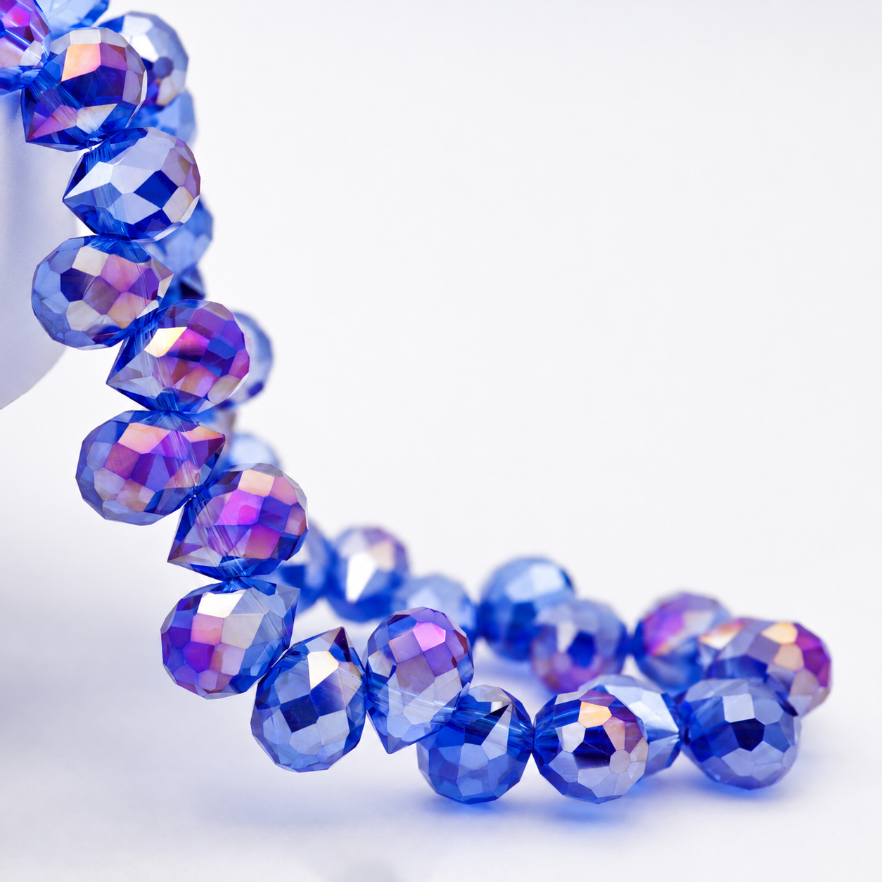 Medium Blue AB faceted teardrop K9 glass bead strand