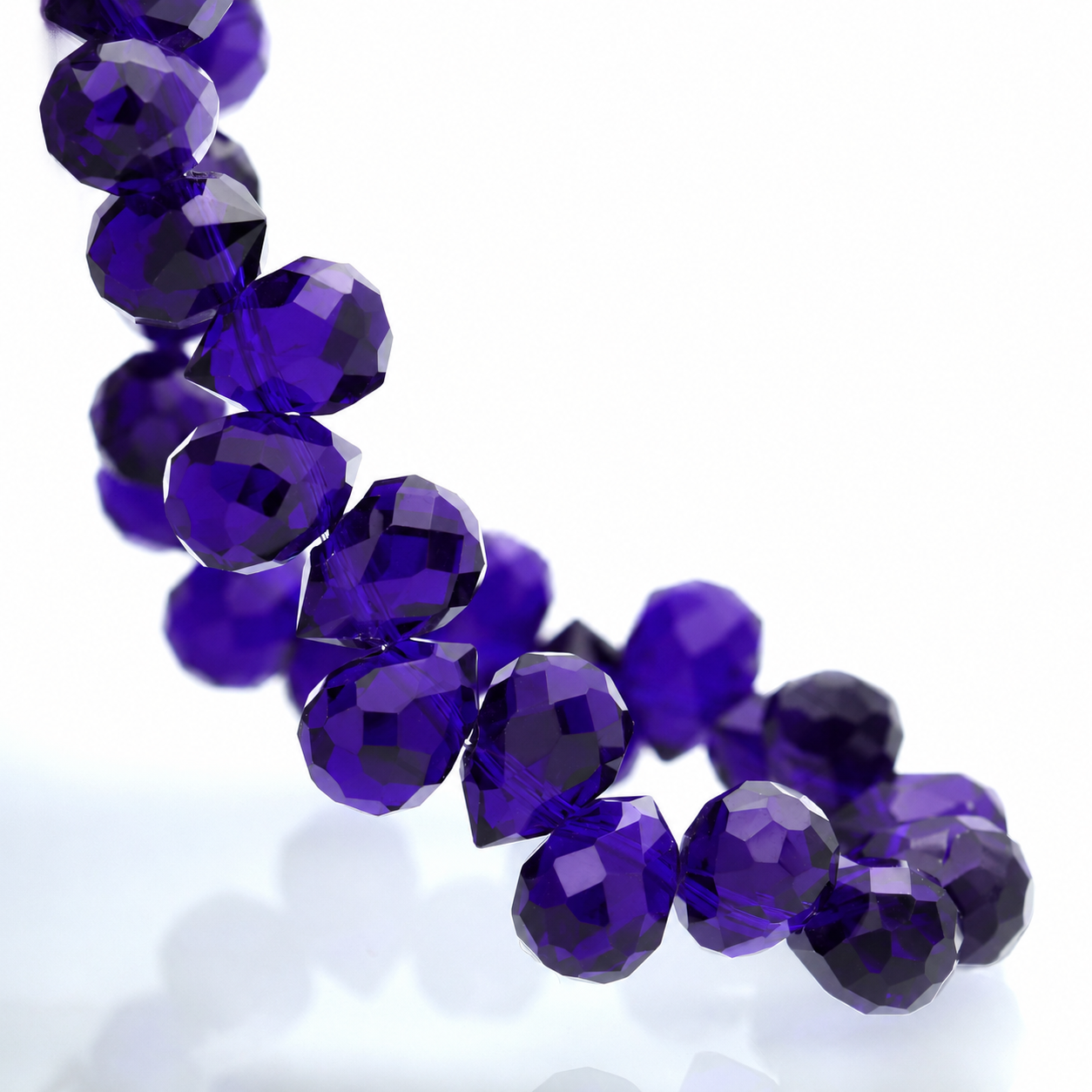 Deep Blue faceted teardrop K9 glass bead strand