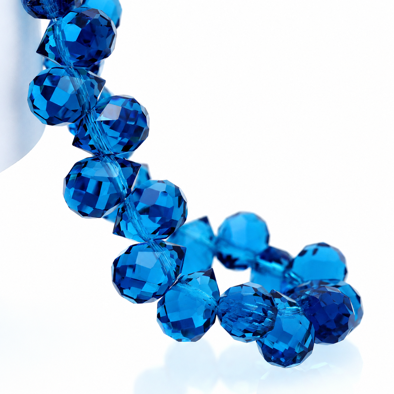 Peacock Blue faceted teardrop K9 glass bead strand