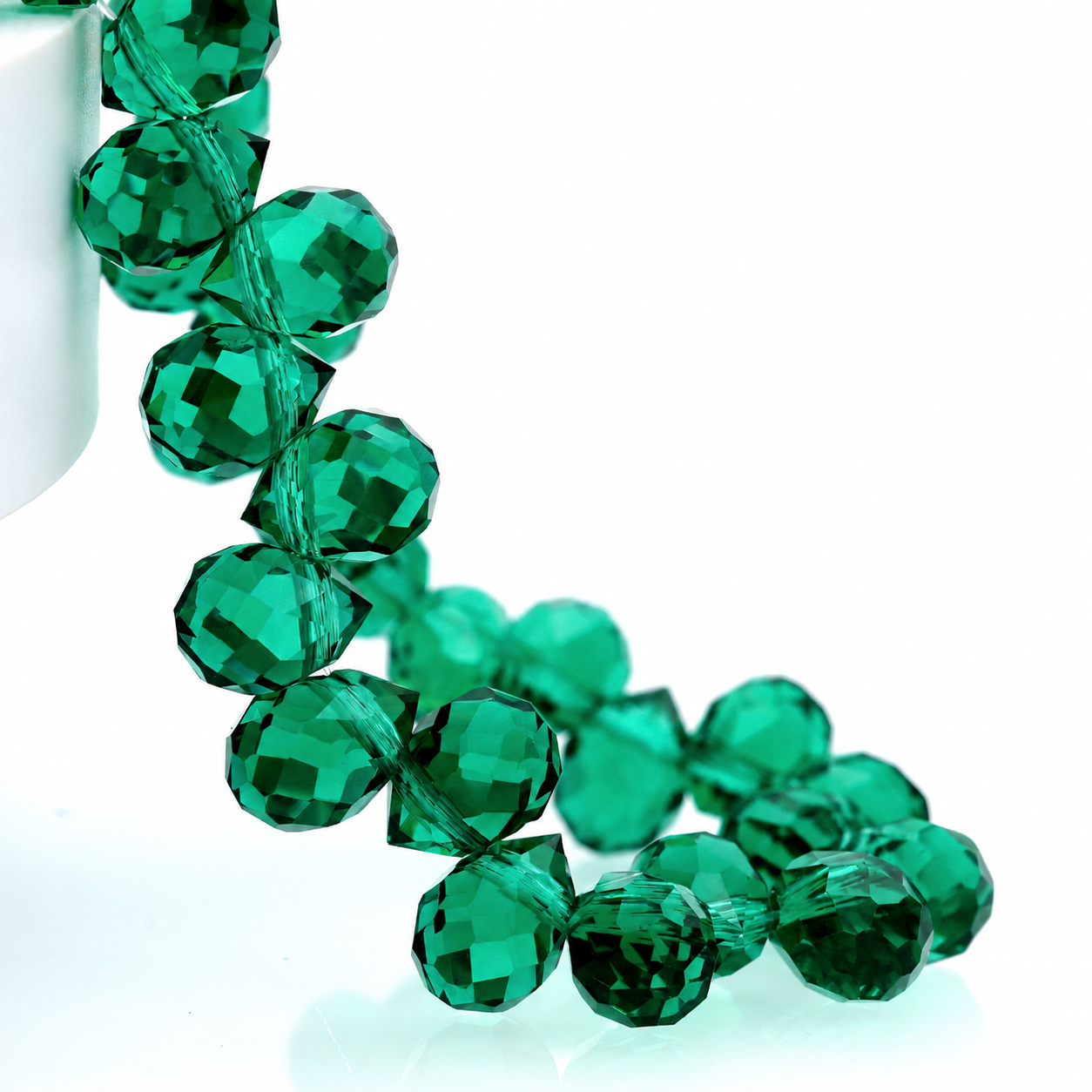 Peacock Green faceted teardrop K9 glass bead strand