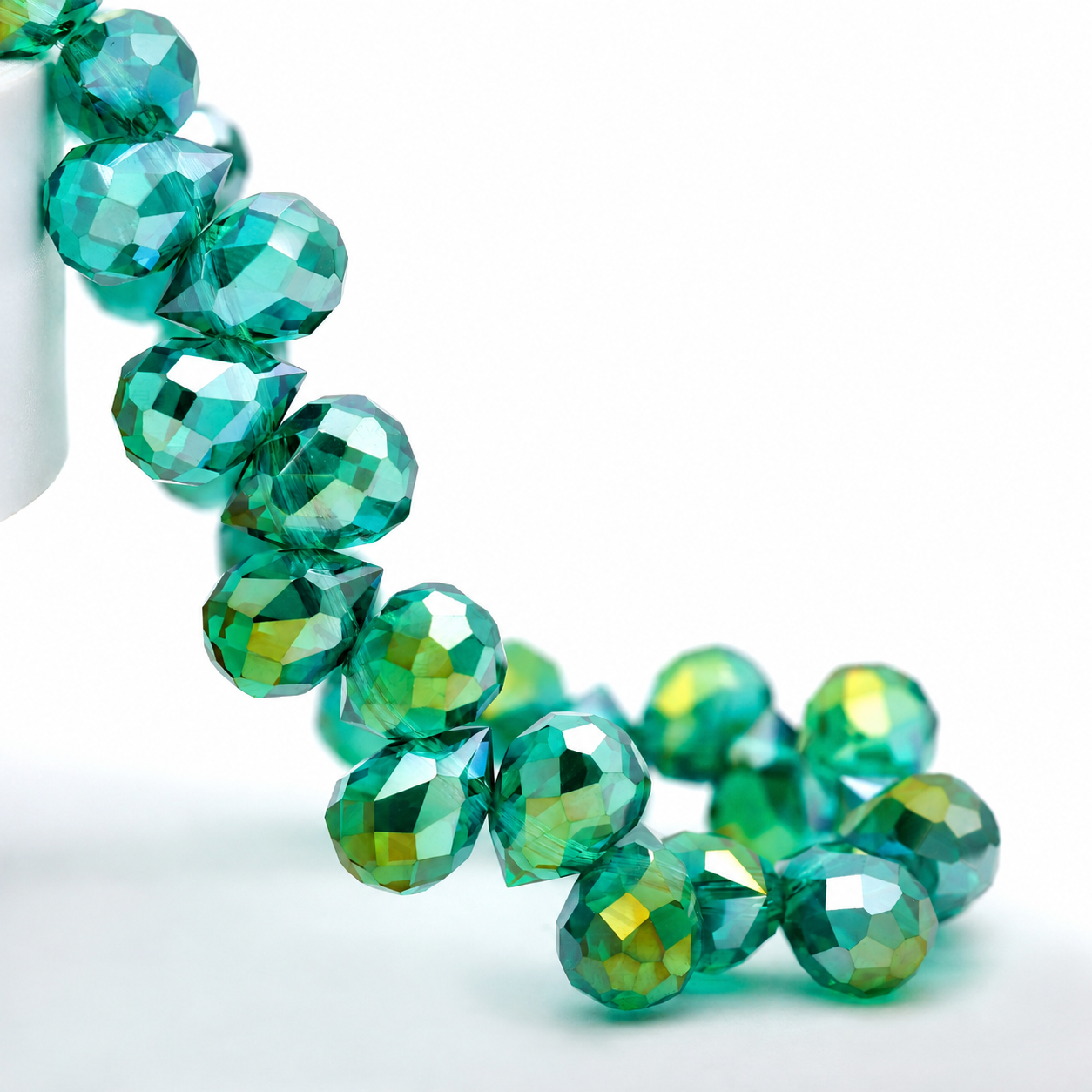 Peacock Green AB faceted teardrop K9 glass bead strand