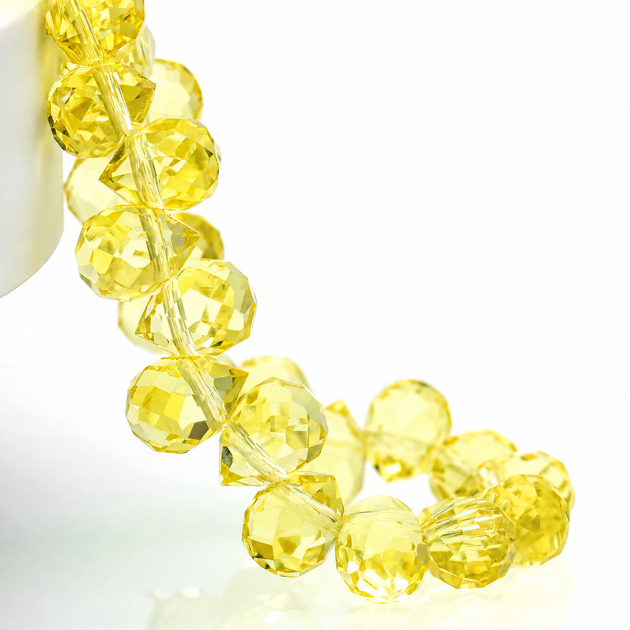 Light Yellow faceted teardrop K9 glass bead strand
